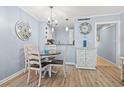 Charming dining area with a round table and a view into the kitchen at 415 Ocean Creek Dr. # 2159, Myrtle Beach, SC 29572