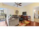 Inviting living room featuring hardwood floors, ceiling fan, and sliding door to porch at 4502 Sweetwater Blvd. # 4502, Murrells Inlet, SC 29576