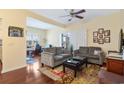 Cozy living room with hardwood floors, ceiling fan, and comfortable seating at 4502 Sweetwater Blvd. # 4502, Murrells Inlet, SC 29576