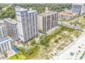 Aerial view of oceanfront condos featuring multiple pools, beach access and beautifully manicured landscaping at 5308 N Ocean Blvd. # 2108, Myrtle Beach, SC 29577