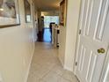 Inviting hallway with tile flooring leading to the living area and featuring a coat closet at 637 Waterway Village Blvd. # 13-E, Myrtle Beach, SC 29579