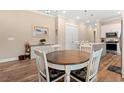 Cozy dining area with a round table, seating for four, and modern decor at 8155 Living Tide Dr., Myrtle Beach, SC 29572