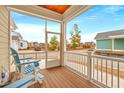 Relaxing screened porch featuring wood flooring and comfortable seating, perfect for enjoying the outdoors at 8155 Living Tide Dr., Myrtle Beach, SC 29572