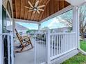 Relaxing front porch area with rocking chairs and a white railing, offering a comfortable outdoor space at 920 Leather Leaf Ln., Longs, SC 29568