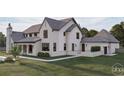 Angle view of a beautiful home, showcasing a pristine lawn, covered patio, and modern exterior features at 9413 Park St., Myrtle Beach, SC 29572