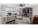 Comfortable living room with media cabinet, stylish area rug and an adjacent modern kitchen at 1109 Donald St., Conway, SC 29527