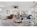 Bright, open living space featuring a large sectional sofa and an adjacent modern kitchen at 1109 Donald St., Conway, SC 29527