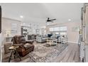 Bright, open living space featuring a large sectional sofa and an adjacent modern kitchen at 1109 Donald St., Conway, SC 29527