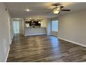 Spacious living room and kitchen area with hardwood floors and modern appliances at 125 South Shore Blvd. # 201, Longs, SC 29568