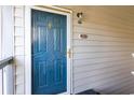 A front door with glass and gold hardware. The door is numbered 204 and has an outdoor light at 1356 Glenns Bay Rd. # 204D, Surfside Beach, SC 29575