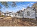 Rear view of home with a white wooden fence and large window overlooking the yard at 1639 Coventry Rd., Surfside Beach, SC 29575