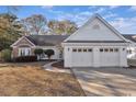 Charming one-story home featuring a brick facade, two-car garage and well-maintained landscaping at 1639 Coventry Rd., Surfside Beach, SC 29575