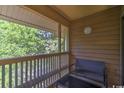 Cozy balcony offers a seating area with a tranquil outdoor view at 180 Rothbury Circle # 303, Myrtle Beach, SC 29572