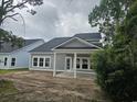 Elegant home with a covered back porch and a freshly landscaped yard at 1808 Sunshine Ct., North Myrtle Beach, SC 29582