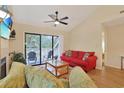 Living room featuring a fireplace, ceiling fan, and sliding glass doors to the balcony at 222 Westleton Dr. # 18D, Myrtle Beach, SC 29572