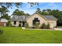 Traditional home with well-kept lawn and sidewalk leading to the inviting covered front porch at 2264 Wedgefield Rd., Georgetown, SC 29440