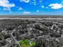 Scenic aerial view of a home nestled in a wooded community near a winding river at 25 Berwick Dr., Pawleys Island, SC 29585