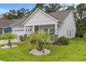 Beautifully landscaped front yard with a manicured lawn and charming curb appeal at 2568 Goldfinch Dr., Myrtle Beach, SC 29577