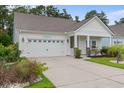 Inviting single-story home showcasing a manicured lawn and a pristine two-car garage at 2568 Goldfinch Dr., Myrtle Beach, SC 29577