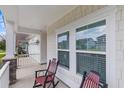 Cozy front porch featuring comfortable rocking chairs and charming architectural details at 2568 Goldfinch Dr., Myrtle Beach, SC 29577