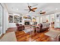 Inviting living room with fireplace, hardwood floors, and custom built-ins at 3369 Collins Creek Dr., Murrells Inlet, SC 29576