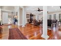 Open living space with hardwood floors and seamless flow to adjacent rooms at 3369 Collins Creek Dr., Murrells Inlet, SC 29576