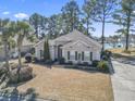 An elevated view of the house showcases its setting near a lake at 356 Carriage Lake Dr., Little River, SC 29566