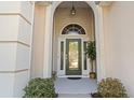 Arched front entryway with glass paneled door at 356 Carriage Lake Dr., Little River, SC 29566