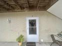 Welcoming front entrance featuring a white door, brick facade, and covered porch at 3677 Claypond Village Ln. # 4, Myrtle Beach, SC 29572