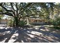 Cozy one-story home nestled amongst mature oak trees offering shaded curb appeal at 402 Wilkinson St., Georgetown, SC 29440