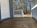 Wooden deck of the home with door and white railing at 415 Circle Dr., Johnsonville, SC 29555