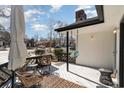 Cozy porch with outdoor seating and hanging swing offering views of the surrounding neighborhood at 4305 Frontier Dr., Myrtle Beach, SC 29577