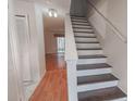 Foyer with staircase and view into living area featuring hardwood floors at 504 30Th Ave. N # 3, Myrtle Beach, SC 29577