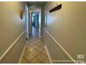 Hallway with tile flooring and decorative wall accents at 5511 N Ocean Blvd. # 1006, Myrtle Beach, SC 29577