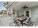 Spacious covered porch featuring ceiling fans and comfortable outdoor seating, perfect for relaxation at 6001-1723 South Kings Hwy., Myrtle Beach, SC 29575