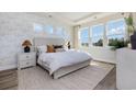 Sunlit main bedroom featuring tray ceiling, large windows, and neutral decor at 746 Plumage Ct., Myrtle Beach, SC 29588