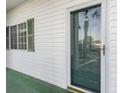 Close-up of the front door with a window and green shutters at 750 Charter Dr. # E-2, Longs, SC 29568