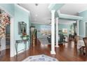 Spacious foyer with hardwood floors, decorative columns, and a glimpse into the living spaces at 862 Edgewater Dr., Murrells Inlet, SC 29576