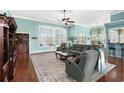 Cozy living room with plush seating, natural light, hardwood floors and lake views at 862 Edgewater Dr., Murrells Inlet, SC 29576