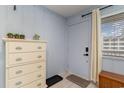 Light blue entryway featuring a dresser, window, and door at 900 N Waccamaw Dr. # 305, Murrells Inlet, SC 29576