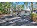 View of the carport attached to the home, with large parking area at 935 Little Creek Rd., Myrtle Beach, SC 29572