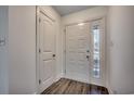 Bright entryway features a door with decorative glass and hardwood-style floors at 935 Little Creek Rd., Myrtle Beach, SC 29572