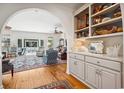 Cozy living room with hardwood floors, comfortable seating, and built-in shelves showcasing decorative items at 938 Wallace Pate Dr., Georgetown, SC 29440