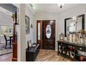 Inviting entryway with hardwood floors, decorative touches, and a stylish front door at 1 Sun Ct., Carolina Shores, NC 28467
