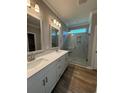 Beautiful bathroom featuring double sinks, quartz countertop, and a glass-enclosed walk-in shower at 1067 Laconic Dr., Myrtle Beach, SC 29588