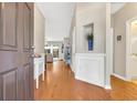 Inviting foyer with hardwood floors, elegant trim, and a view into the spacious living area, creating an open atmosphere at 110 Summerlight Dr., Murrells Inlet, SC 29576