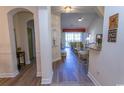 Hallway leading to the living room with a balcony, bar stool seating at the granite counter at 2241 Waterview Dr. # 134, North Myrtle Beach, SC 29582