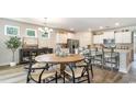 Kitchen and dining area with a center island, stainless steel appliances, and modern decor at 412 Clear Lake Dr., Conway, SC 29526