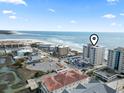 Aerial shot of condo and the beach near the ocean on a clear day at 6200 N Ocean Blvd. # 101, North Myrtle Beach, SC 29582