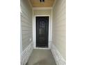 Elegant black wrought-iron front door with decorative details and stone accents at 740 Jade Dr., Myrtle Beach, SC 29579